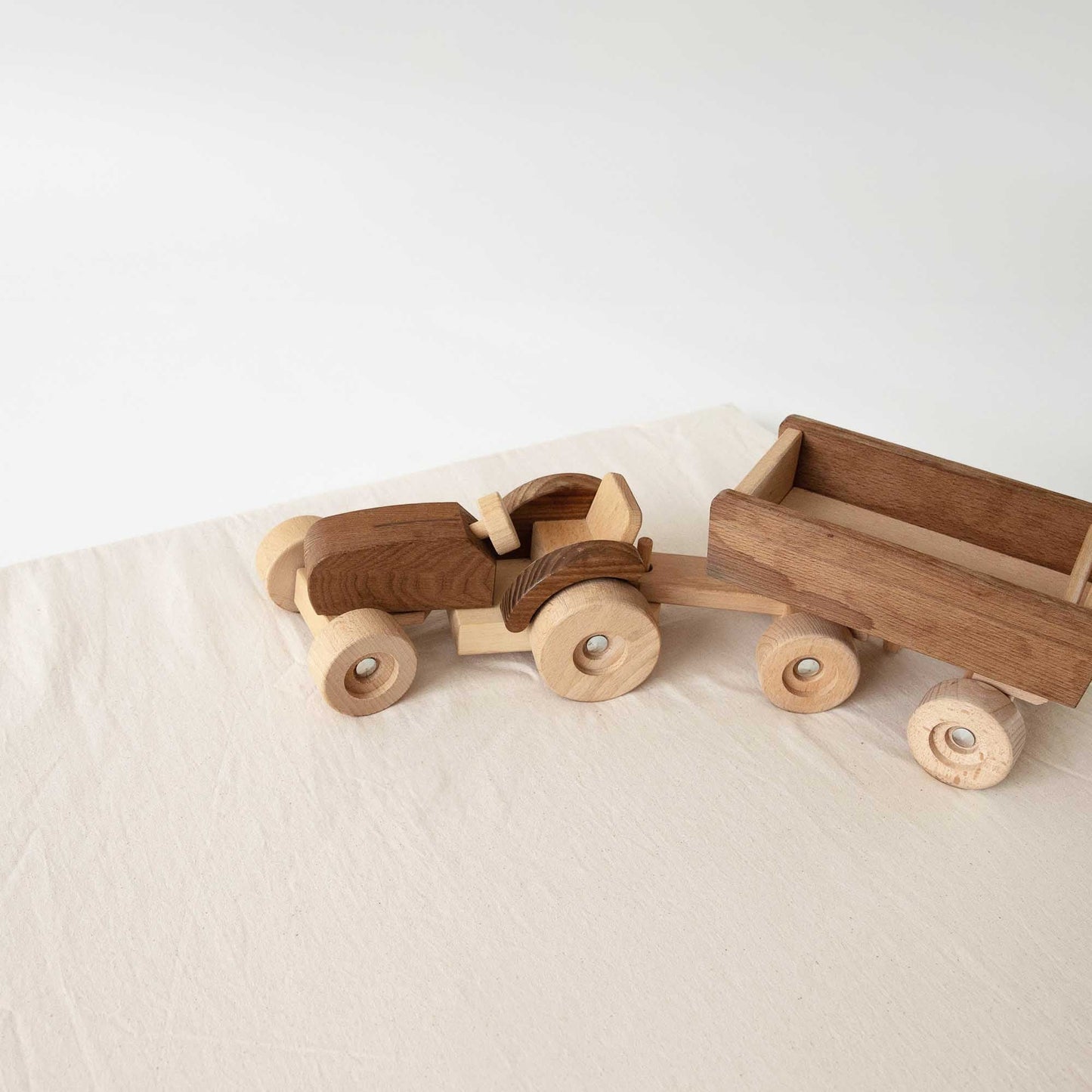 Light Natural Padded Play Mat with wooden toy trucks, perfect for playtime.